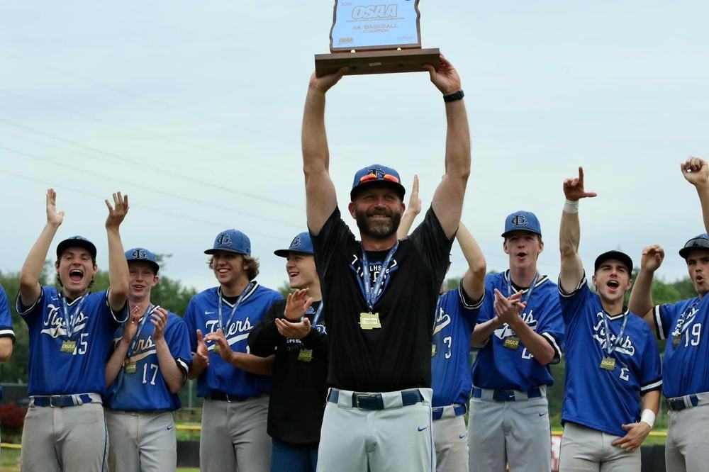 Picture of Parker McKinley and team holding state champion trophy