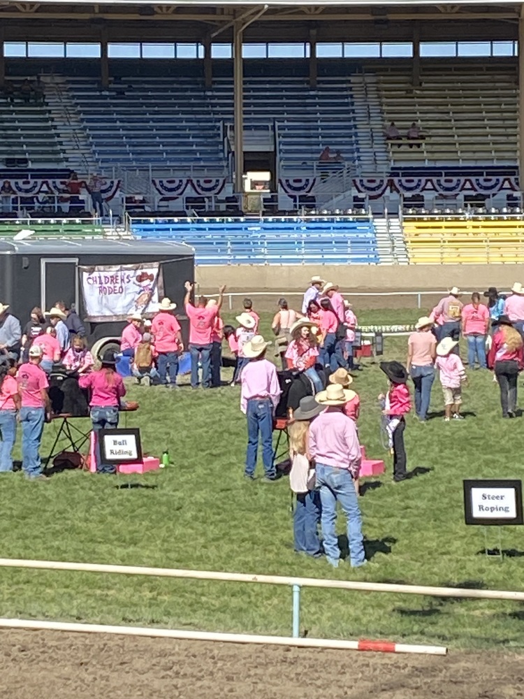 kids and adults in pink in the Pendleton Round Up Arena