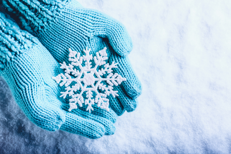 Winter gloves with a white snowflake