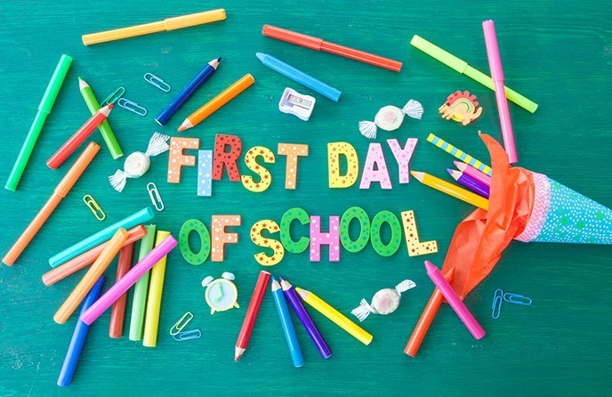 First Day of School with pens and pencils around the wording