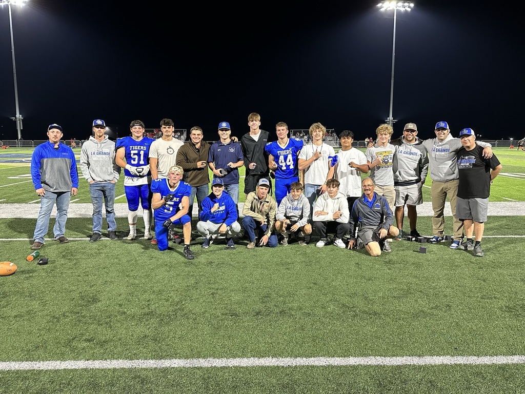 photo of 2023 LHS State Champion wrestlers on EOU football field after they received their state champion rings